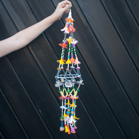 Pajaki Chandalier DIY Tutorial. A pajaki is a traditional Polish craft consisting of pom poms, straw and colorful paper.